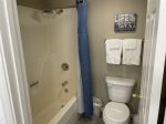 Nice size master powder room with toilet and a shower tub combination